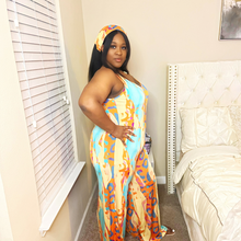 Load image into Gallery viewer, Abstract JumpsuitAbstract JumpsuitSandiyah&#39;s Closet This jumpsuit is a true embodiment of fashion and comfort, perfect for those who want to make a statement while feeling at ease.
 The colorful abstract pattern is a