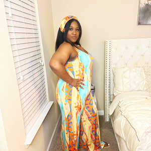 Abstract JumpsuitAbstract JumpsuitSandiyah's Closet This jumpsuit is a true embodiment of fashion and comfort, perfect for those who want to make a statement while feeling at ease.
 The colorful abstract pattern is a